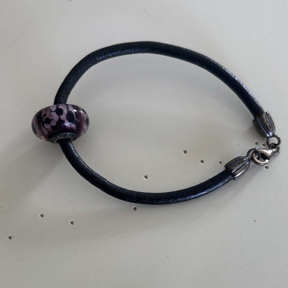 Retired Pandora leather bracelet with purple Murano glass bead.